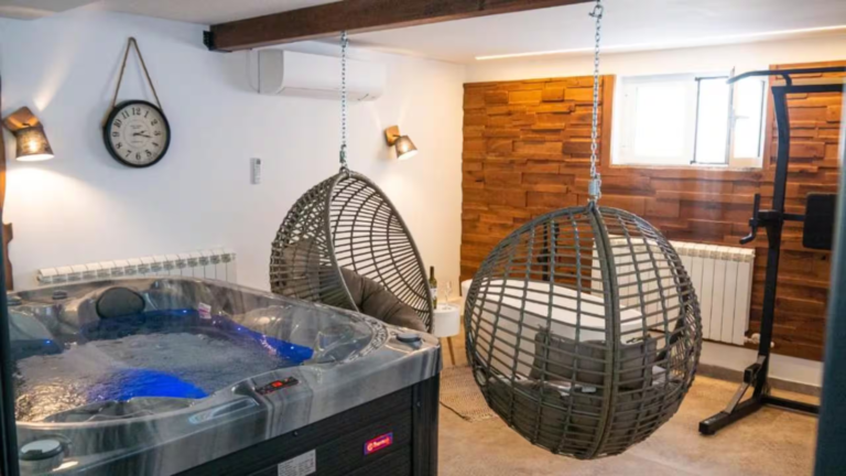 Hot tub and hanging chairs in the wellness room