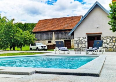 Outdoor pool beside the stone tavern at Grga's Villa