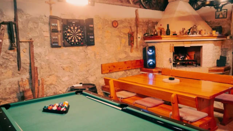Games room with pool table, darts and a fireplace