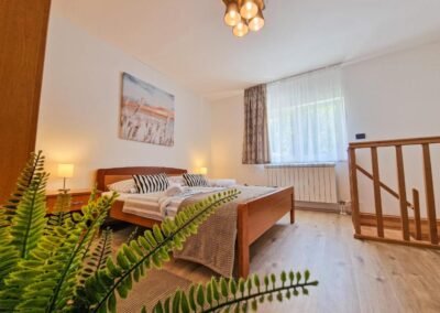 Double bedroom with a view towards the stair railing