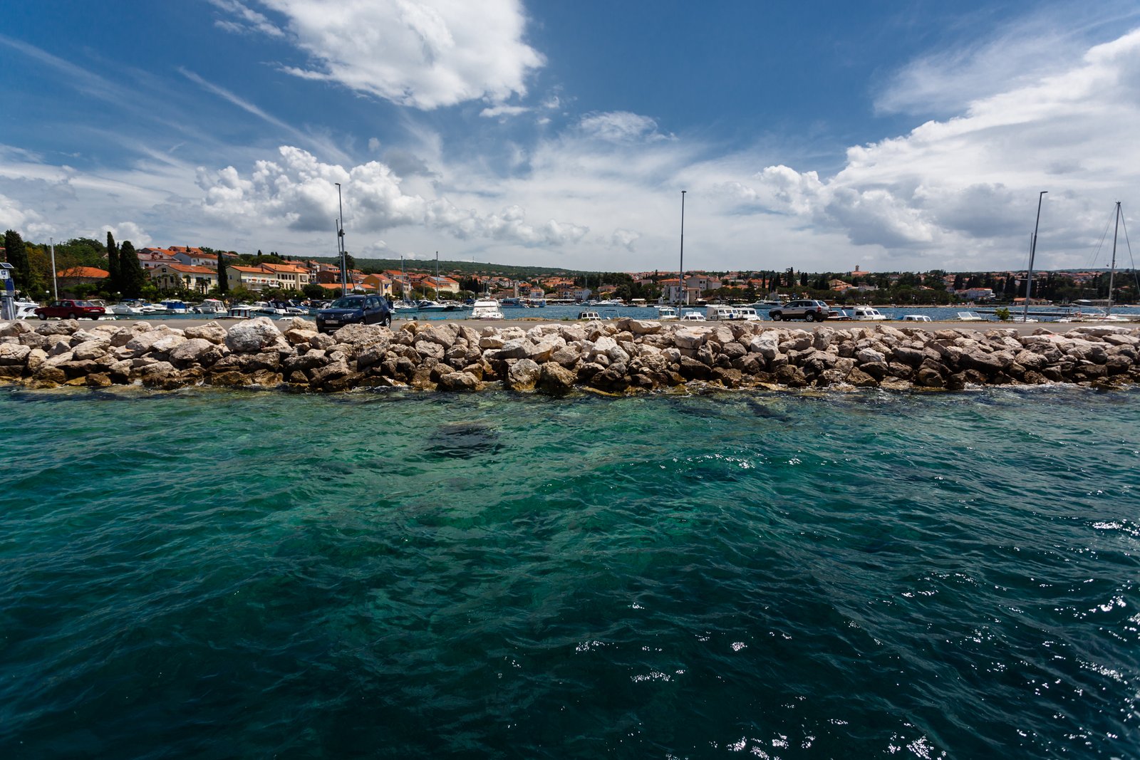 Malinska waterfront seen across the clear Adriatic water