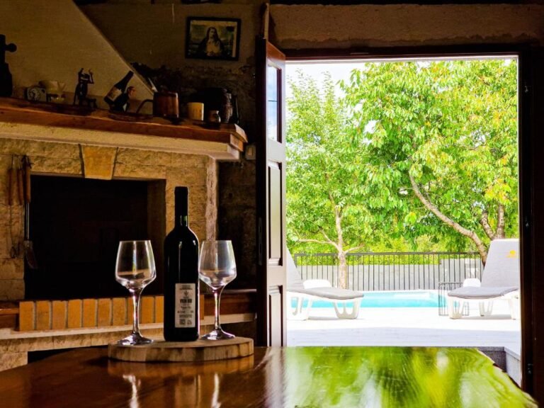 Wine beside the fireplace, looking out to the pool