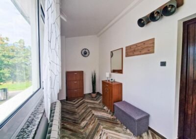 Entrance hall with a bench and coat hooks