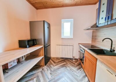 Kitchen with fridge and microwave at Grga's Villa