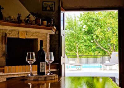 Wine on the tavern table with a view of the outdoor pool